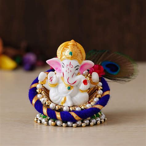 Buy eCraftIndia Resin Lord Ganesha Idol On Peacock Feather Decorative ...