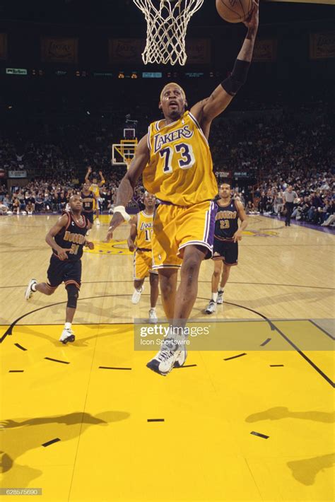Dennis Rodman of the Los Angeles Lakers lays up the ball during a ...