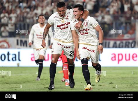 Hugo Ancajima and Jose Rivera of Universitario de Deportes celebrating ...