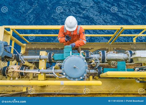 Offshore Oil Rig Worker Checking Parameter of Coriolis Digital Flow ...