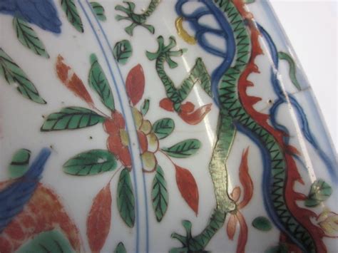 Bonhams : A large wucai dragon and phoenix dish Wanli mark and of the ...