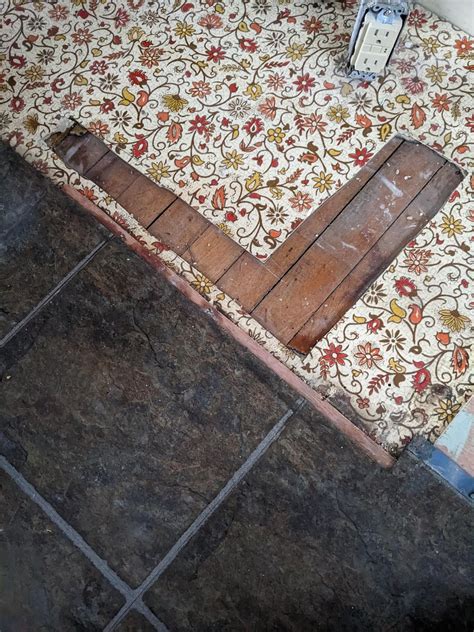 Evolution of flooring in our kitchen. Hardwood covered by rolled ...
