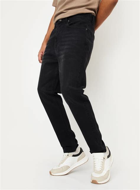 Buy Men Washed Carrot Fit Jeans Online at just Rs. 1299.0 ...