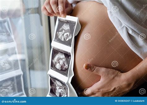 Pregnant Woman Holding an Ultrasound Image of Baby Stock Image - Image ...