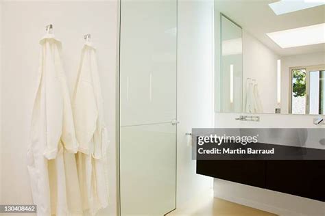 The Ritz-Carlton bath robes hanging in luxury bathroom