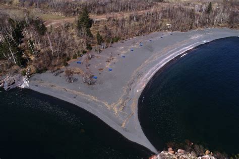 VIDEO: Helicopter hoists 4 children from island off Black Beach ...