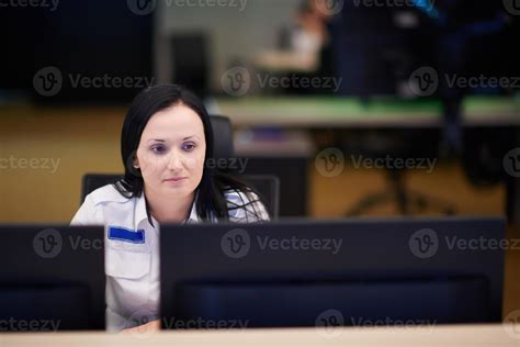 Female operator working in a security data system control room 10829022 ...