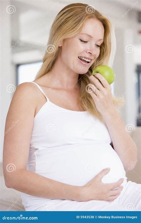 Pregnant Woman Eating Apple and Smiling Stock Photo - Image of female, health: 5943538