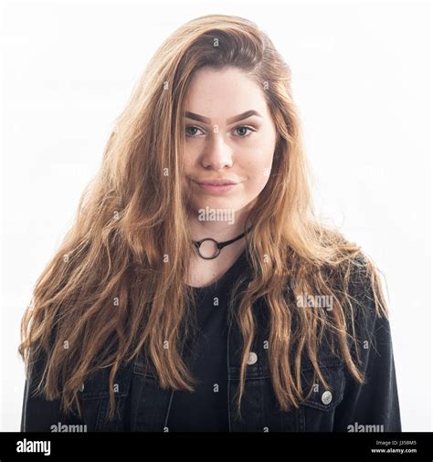 A pretty 15 year old girl in the studio against a white backdrop in the ...