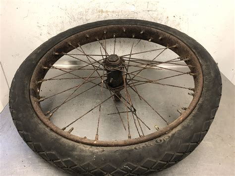 Prewar BSA sidecar wheel and hub 26 x 3. Comes with spindle & BSA cap ...