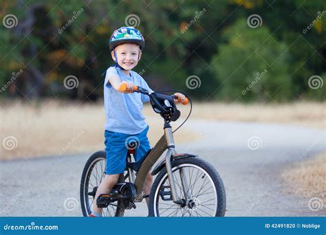 Kid riding bicycle stock photo. Image of male, caucasian - 42491820