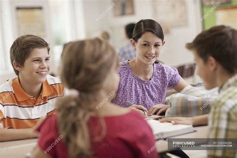 Students talking to each other. — school books, school child - Stock ...