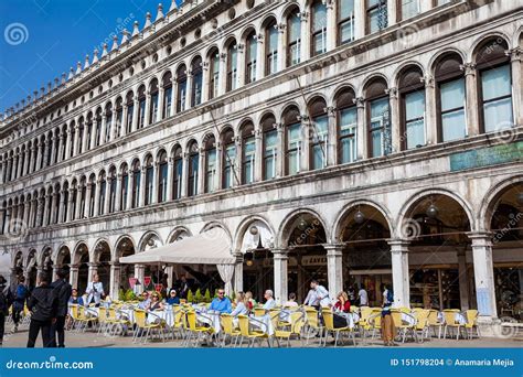 Restaurants and Tourists at the Famous Saint Mark Square of Venice in a ...