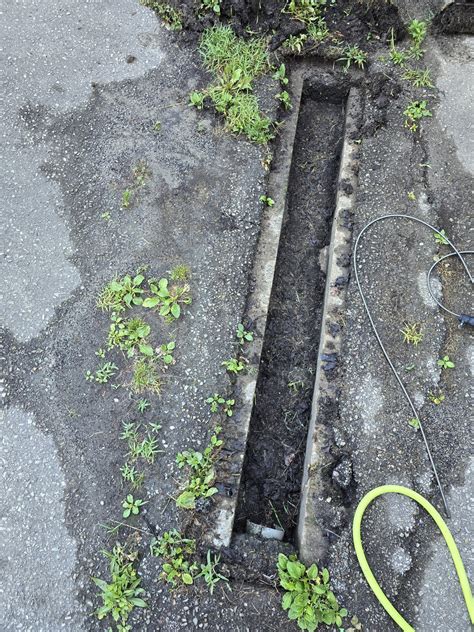 Clogged driveway drain pipe : r/DIY