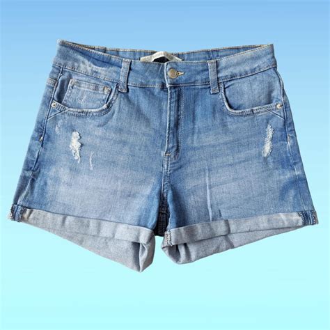Blue denim high rise shorts with turn ups. Will... - Depop