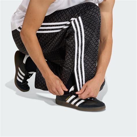 adidas FIREBIRD LOOSE MONOGRAM TRACK PANTS - Black | adidas India