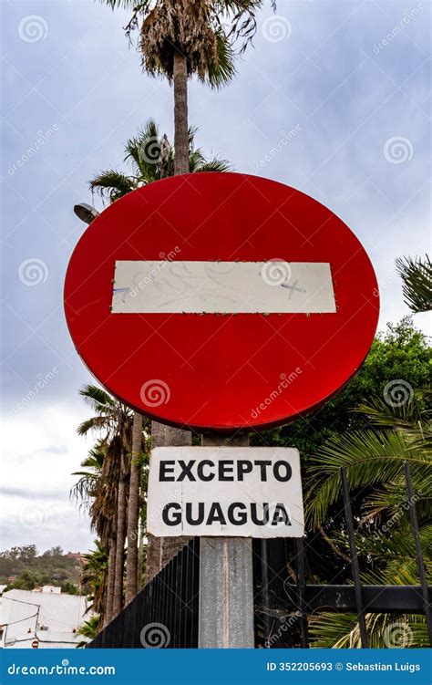 A Red and White Sign with a White Line in the Middle that Says "excepto ...