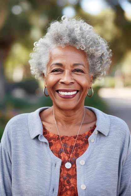 Happy senior african american blond old woman looking at camera with ...