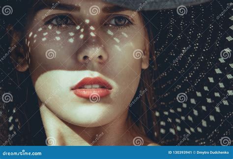 Portrait of a Beautiful Woman in a Black Beach Hat on Holiday by the ...