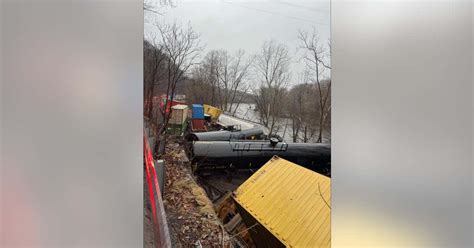 Train derailment leaves cars on riverbank or in water; no injuries ...