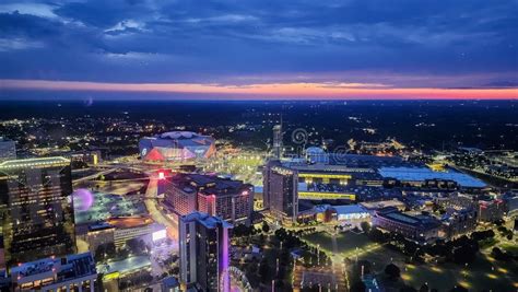 The City Skyline at Sunset with Mercedes-Benz Stadium, the SkyView ...
