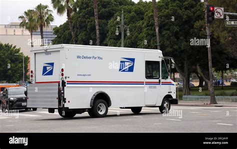U.S. Postal Service (USPS) trucks are parked at a post office on August 23, 2024 in Glendale, Califo