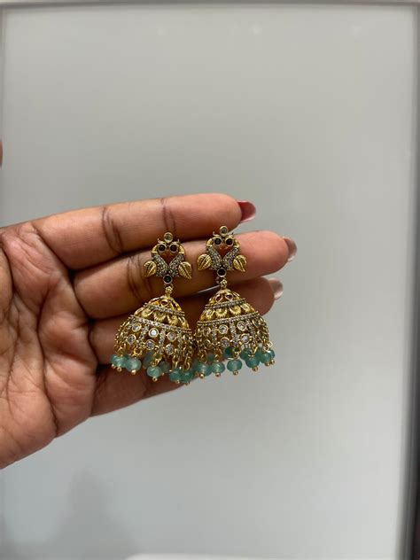 Dual peacock gold jhumkas – Alluring Accessories