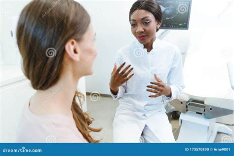 Gynecologist Showing Woman Early Ultrasounds of Her Pregnancy Stock Photo - Image of sonography ...