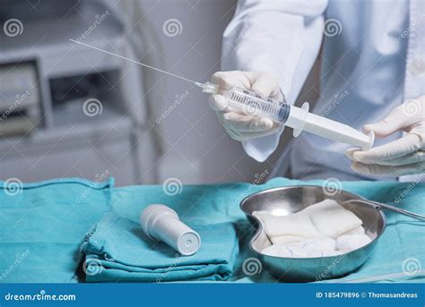 Doctor`s Hands that is Preparing an Amniocentesis Needle for Amniotic Fluid Extraction Stock ...