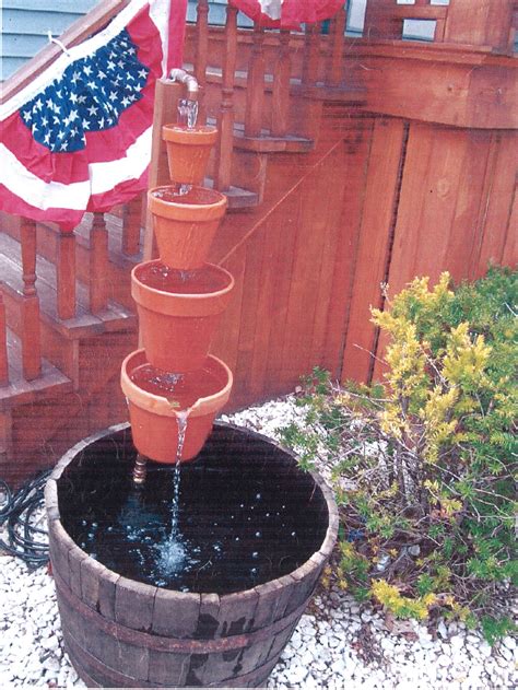DIY Clay Pot Waterfall Fountain in Wine Barrel