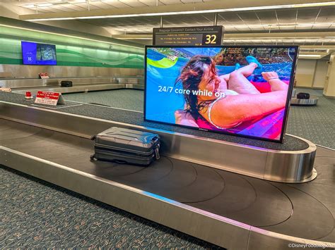 Passengers look at flight delays on a departure board at Orlando International Airport on November 0