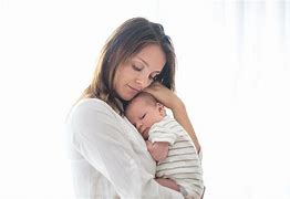 Image result for Young Parents Holding Baby