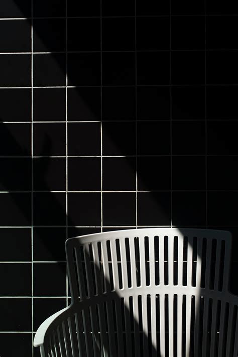 Download wallpaper 3840x5760 seat, tile, bw, wall hd background