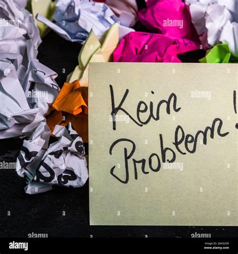 Writing no problem in german (kein problem) on memo post reminder. Text ...
