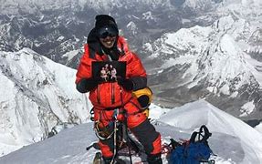 Image result for Mountaineer climbs rare Everest ‘triple crown’