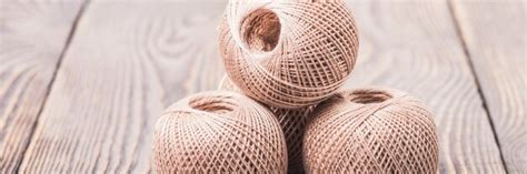 Balls of yarn thread for knitting on a wooden space. | Premium Photo