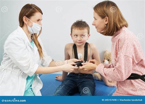 Pediatrician Checking Child Heart Rhythm with ECG Holter Monitor Stock Photo - Image of cardiac ...