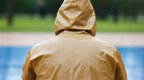 A person wearing a rain coat | Premium AI-generated image