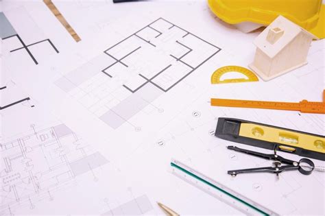 High angle view of blueprints at desk | Premium Photo