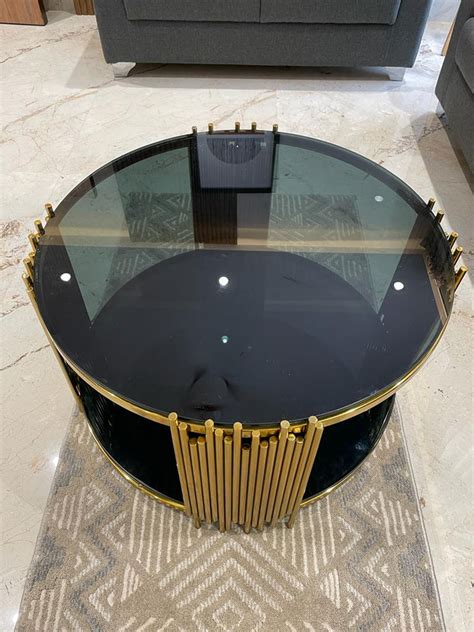 ELLIPTICAL GLASS ANODIZE CENTER TABLE – SUREKH DECOR