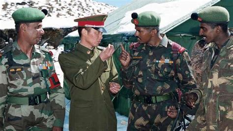 China has been amassing a large contingent of troops and armaments ...