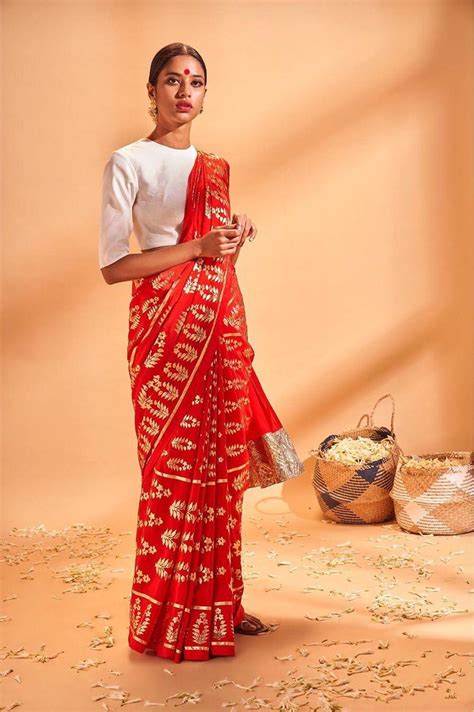 Look Hot in a Red Saree With Golden Border This Wedding Season