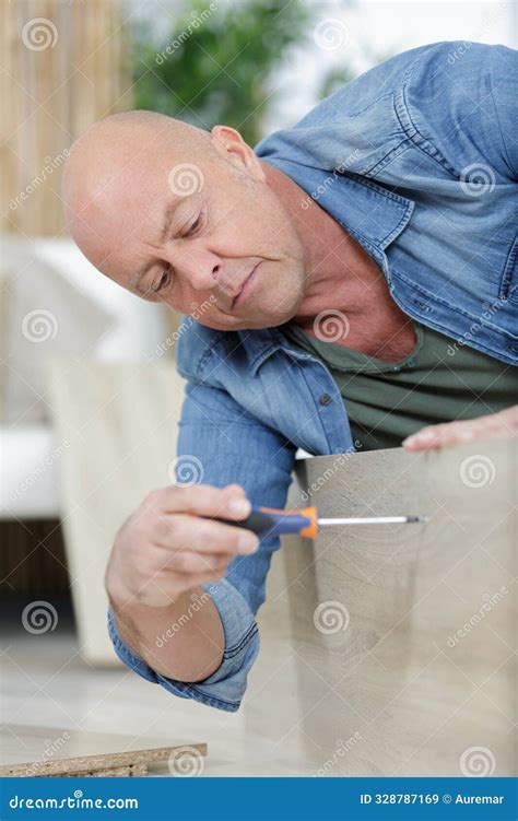 Mature Man Screwing Screws into Furniture Fittings Stock Image - Image ...