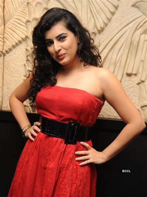 Archana sizzles in an off shoulder red outfit, during a photoshoot.