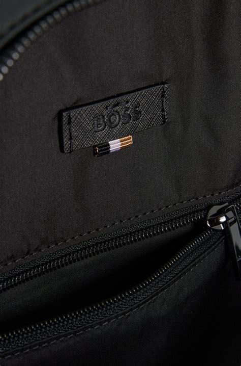 BOSS - Backpack with monogram-patterned pocket - Black