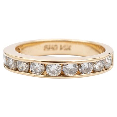 Ladies 14K Yellow Gold Diamond Channel Wedding Band For Sale at 1stDibs