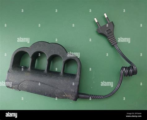 Taser brass knuckles for self-defense and defense Stock Photo - Alamy