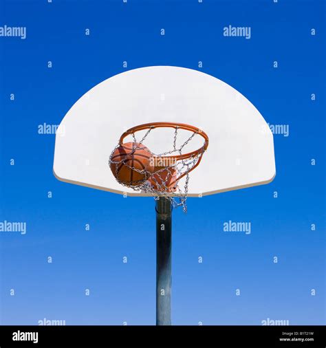 A basketball goes through hoop Stock Photo - Alamy