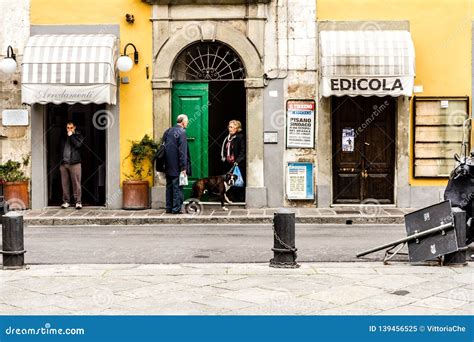 Pisa, Italy - March 17, 2012: Neighbors Talking Near the House on the ...