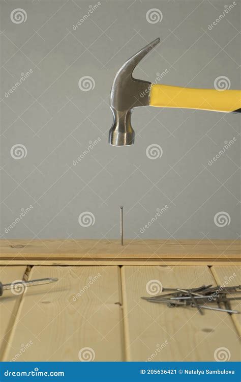 Hammer Hitting Nail on the Head. DIY. Carpenter Hands with Hammer Wood ...